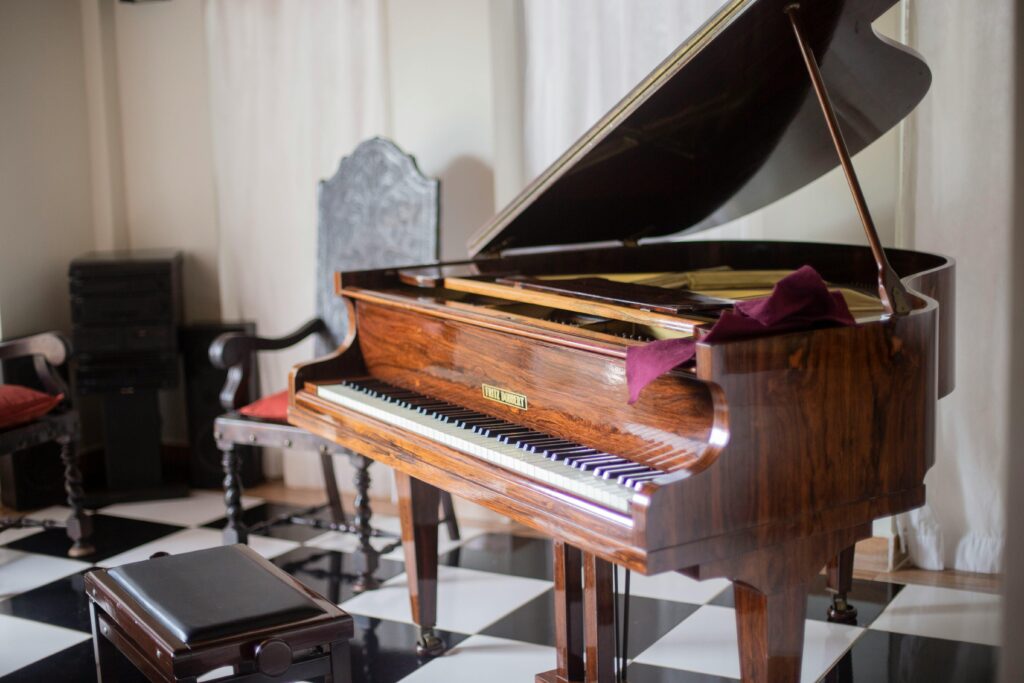 pexels-photo-2043571-2043571 Beautiful wooden grand piano with open lid in a sophisticated room with elegant decor.