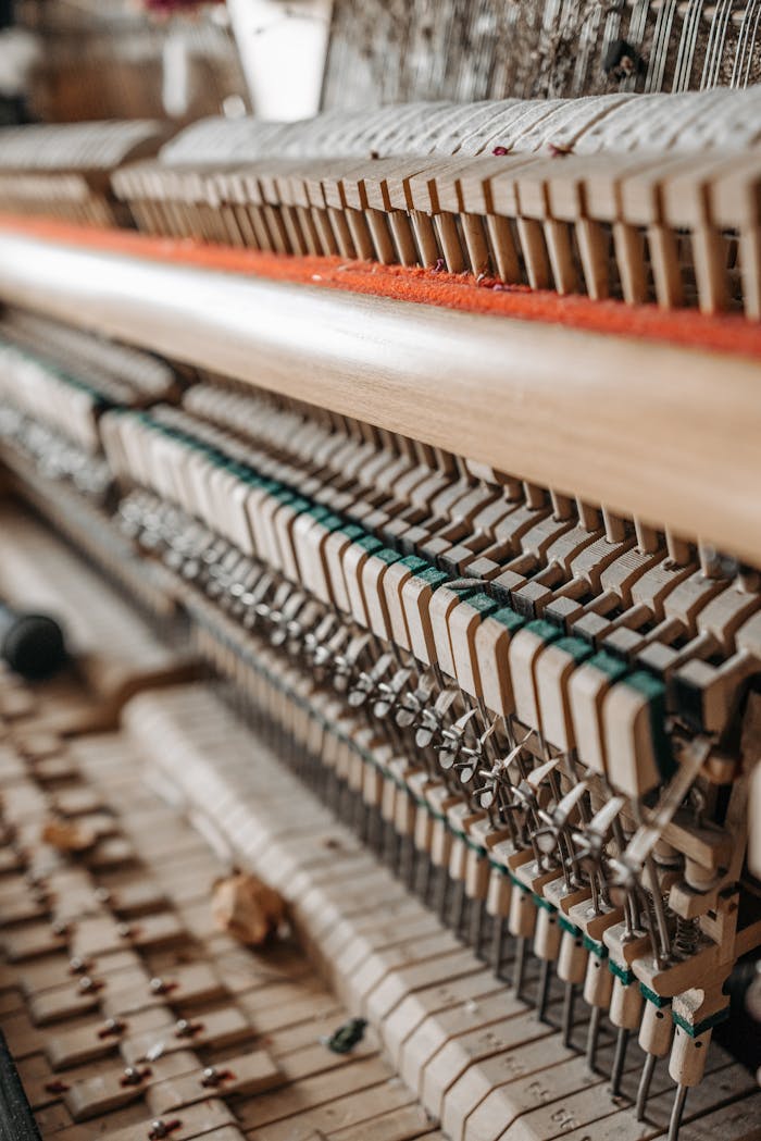 home-hero Detailed view of a piano's internal hammers and strings. Ideal for music enthusiasts.